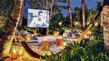 Hängematten mit Film auf Leinwand am Abend